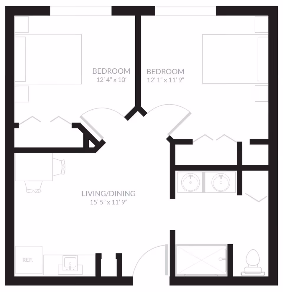 Floor plan of a living space at Inspired Living Ocoee showing two bedrooms, a combined living and dining area, a kitchen area with a refrigerator and sink, and a bathroom with a shower, toilet, and double sinks.