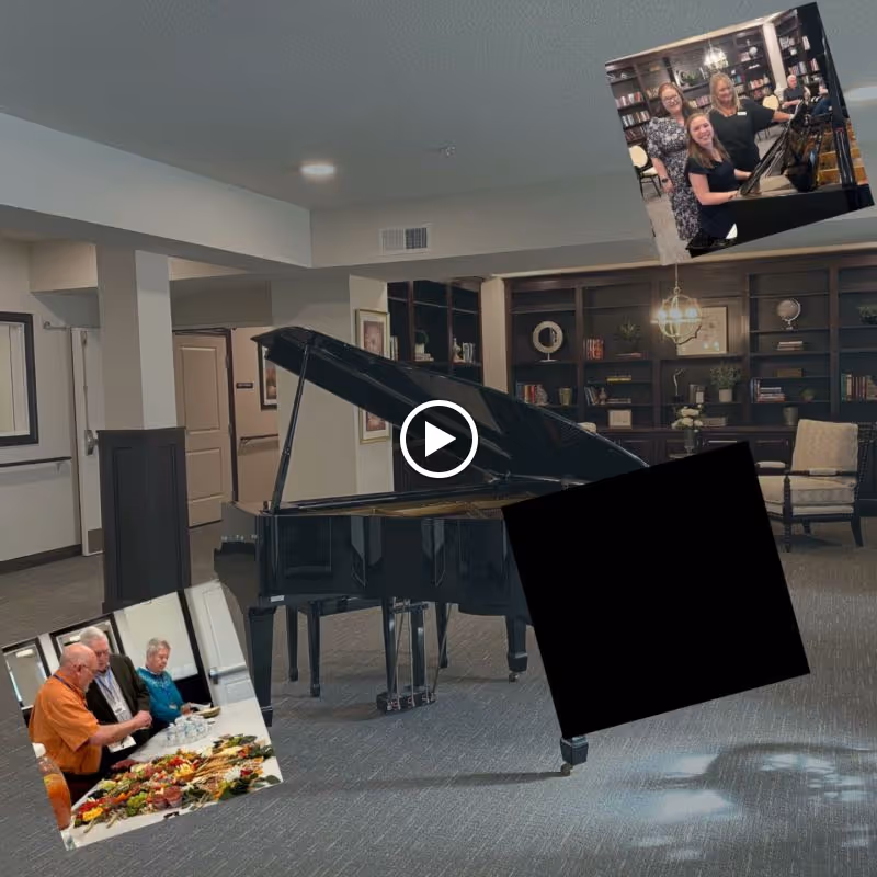 Community lounge with a grand piano centered on carpet in front of built-in bookshelves and seating, with small photo overlays.