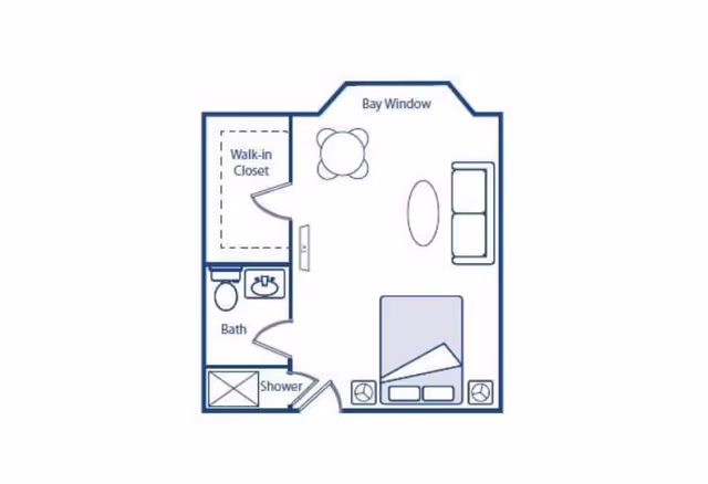 Floor plan of a studio-style apartment showing a bed area, sofa, bay window seating, a walk-in closet, and a bathroom with shower.
