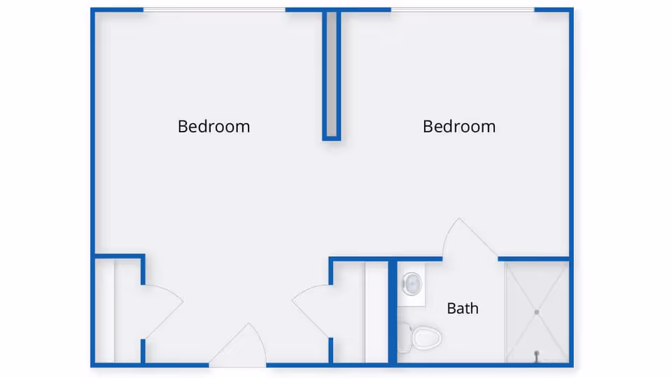 Floor plan layout showing two bedrooms and one bathroom with a shower, toilet, and sink.