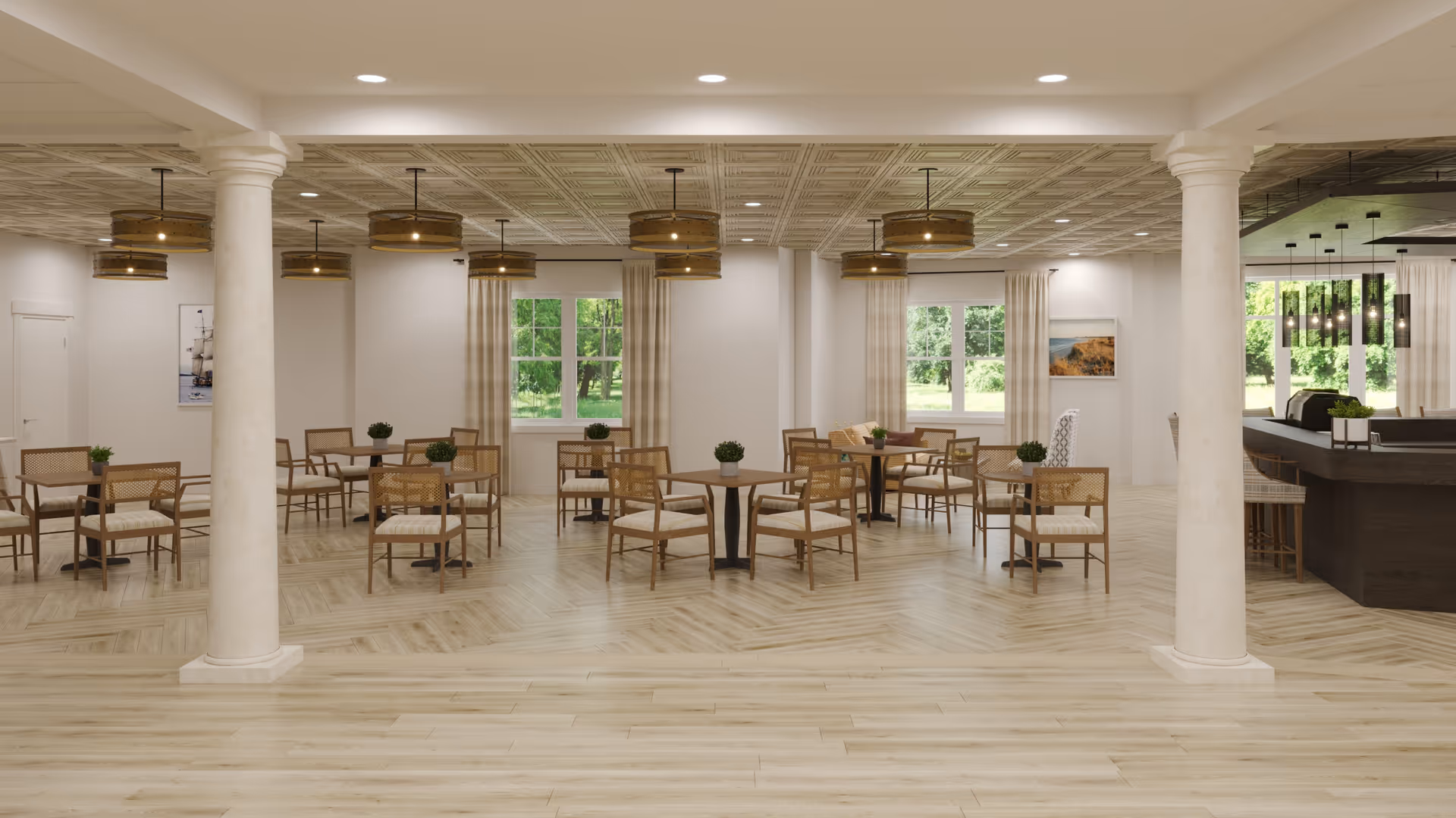 Spacious dining area with multiple wooden tables and chairs arranged neatly. The room features large windows with light curtains allowing natural light to brighten the space. There are decorative plants on each table and modern pendant lights hanging from the ceiling. The floor has a light wood finish and there are white columns supporting the ceiling. A bar area with stools is visible on the right side of the room.