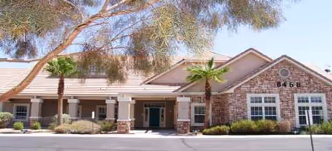 Exterior view of Brookdale East Tucson, a brick senior living facility with a covered entrance.