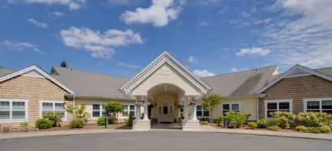 Front view of Brookdale Puyallup South facility entrance with landscaping.