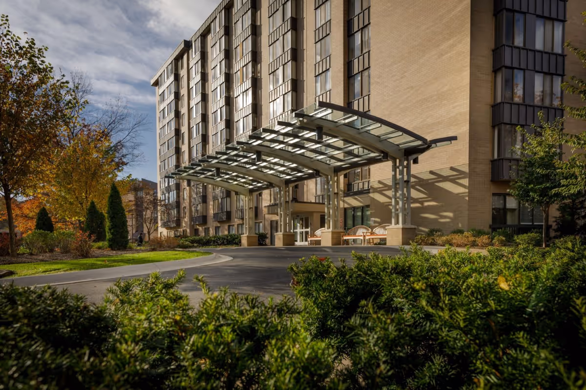 Exterior view of Revitz House senior living facility featuring modern architecture and landscaped surroundings.