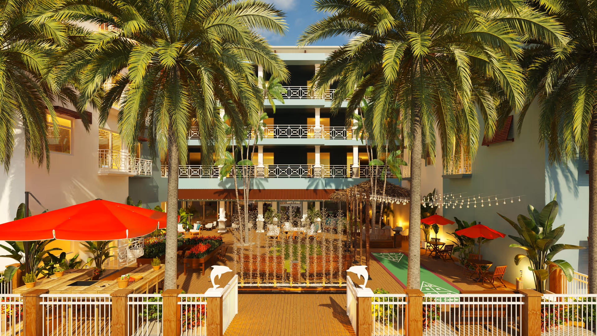Outdoor courtyard area of Bahama Bay Club Luxury Senior Living featuring tall palm trees, a water fountain, wooden deck with seating, red umbrellas shading tables, shuffleboard courts, and string lights under a clear blue sky.