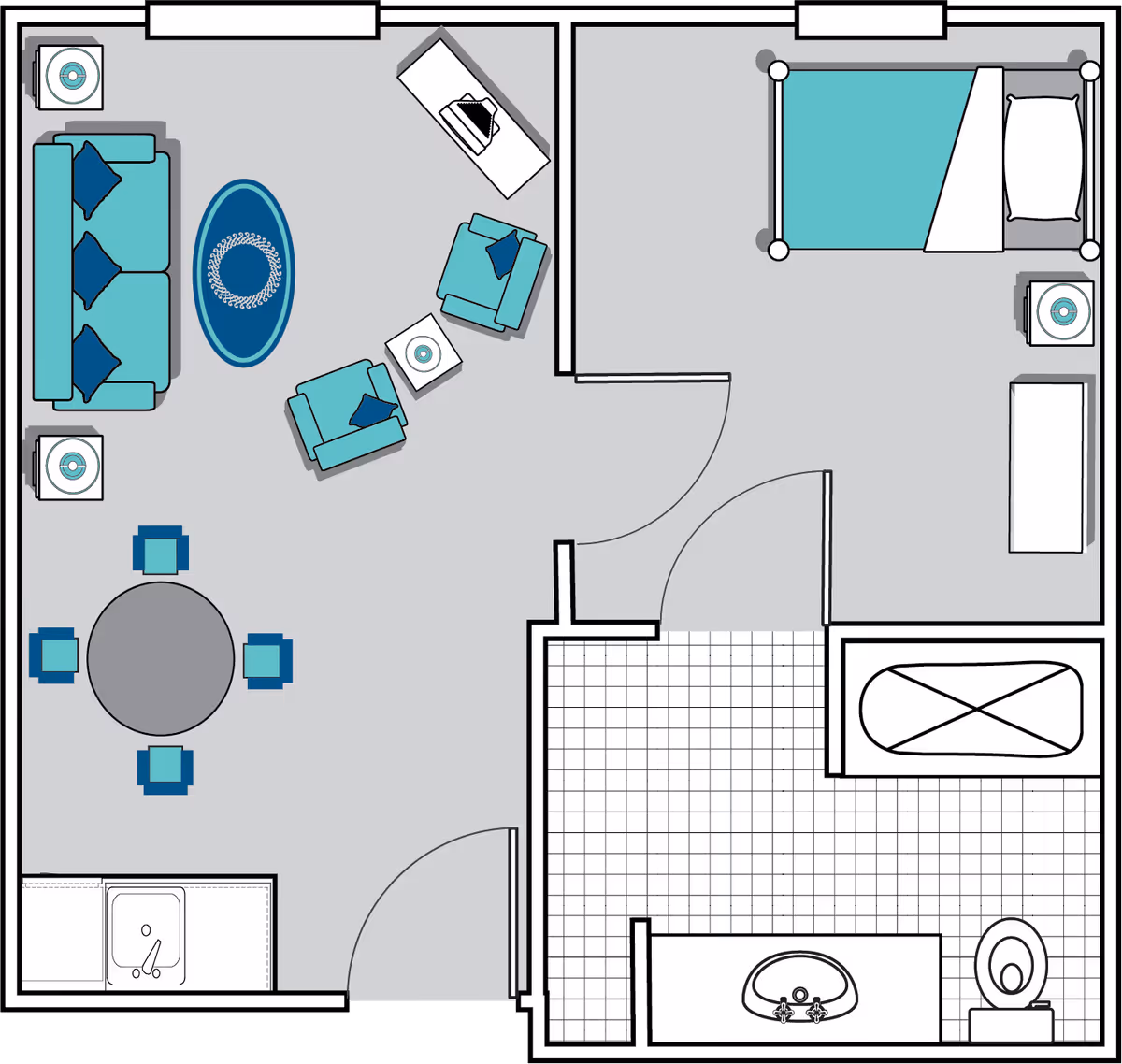 Floor plan of a small apartment unit showing a living room with a sofa, two armchairs, a coffee table, a round dining table with four chairs, and a small kitchen area with a sink. Adjacent to the living room is a bedroom with a bed, nightstand, and dresser. Next to the bedroom is a bathroom with a bathtub, sink, and toilet.