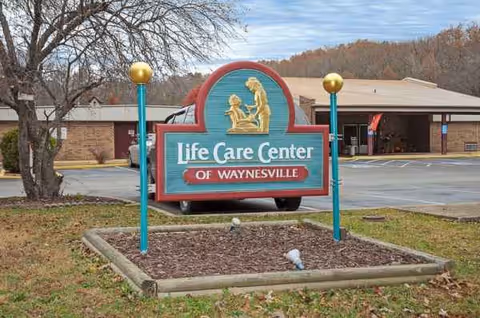 Exterior view of Life Care Center of Waynesville sign in front of the building.