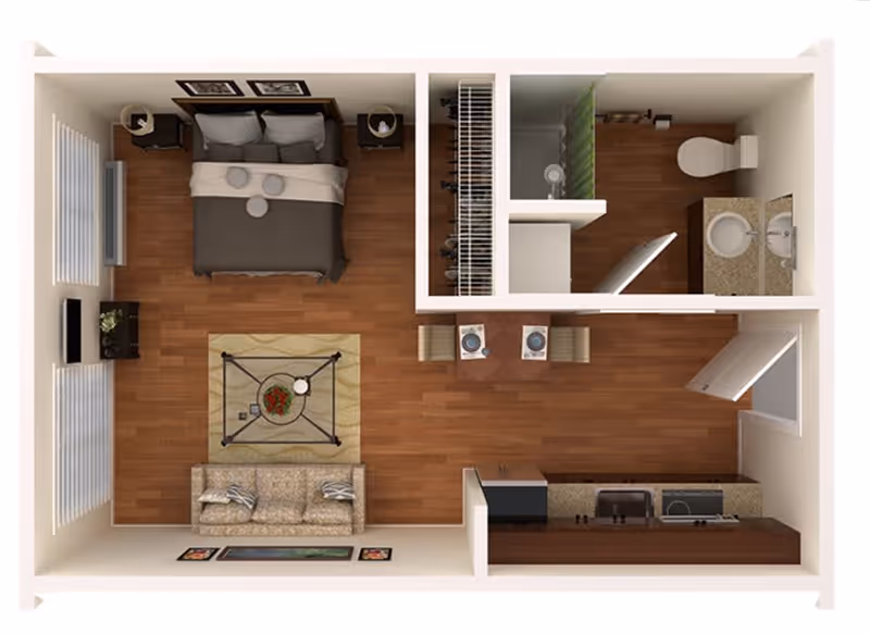 Top-down view of a studio apartment floor plan featuring a bedroom area with a double bed and nightstands, a living area with a sofa and coffee table, a small dining area with two chairs and a table set for two, a kitchen with appliances and a sink, and a bathroom with a toilet, sink, and shower. The apartment has wooden flooring throughout.