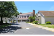 Exterior view of Rappahannock Westminster-Canterbury, showing the front entrance and driveway.