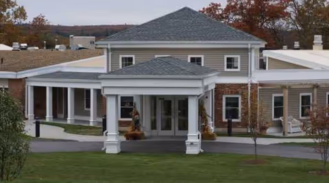 Exterior view of Holden Rehabilitation & Skilled Nursing Center entrance with a covered porch.