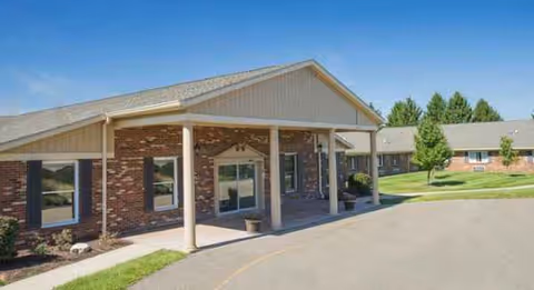 Exterior view of The Colony Healthcare Center with a brick facade and covered entrance.