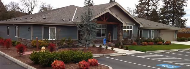 Autumn House of Grants Pass, a single-story senior living facility with landscaped front and accessible parking.