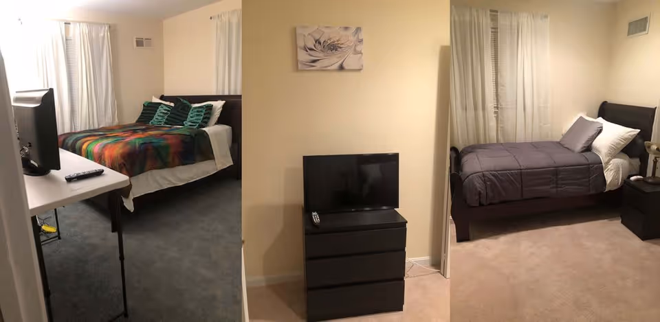 Three views of bedrooms in a senior living facility. The first view shows a bed with a colorful blanket and green pillows, a TV on a white table, and white curtains on the window. The second view shows a black dresser with a TV and remote on top, with a beige wall and a floral wall decoration above. The third view shows a single bed with gray bedding and pillows, a nightstand with a lamp, and white curtains on the window.