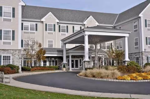 Brandywine Summit by Monarch building exterior with a covered entrance and landscaped circle drive.