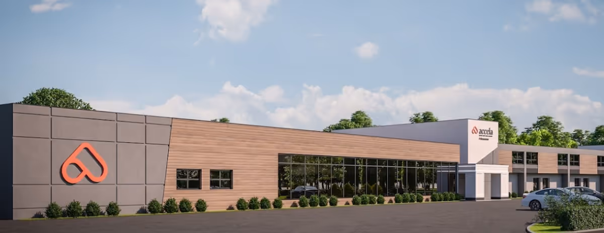 Exterior view of a modern single-story rehab and care center with large windows.