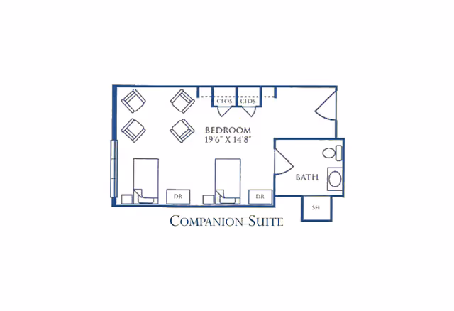 Floor plan of a companion suite showing a bedroom area with two beds, two dressers, four chairs, two closets, and an attached bathroom with a toilet, sink, and shower.
