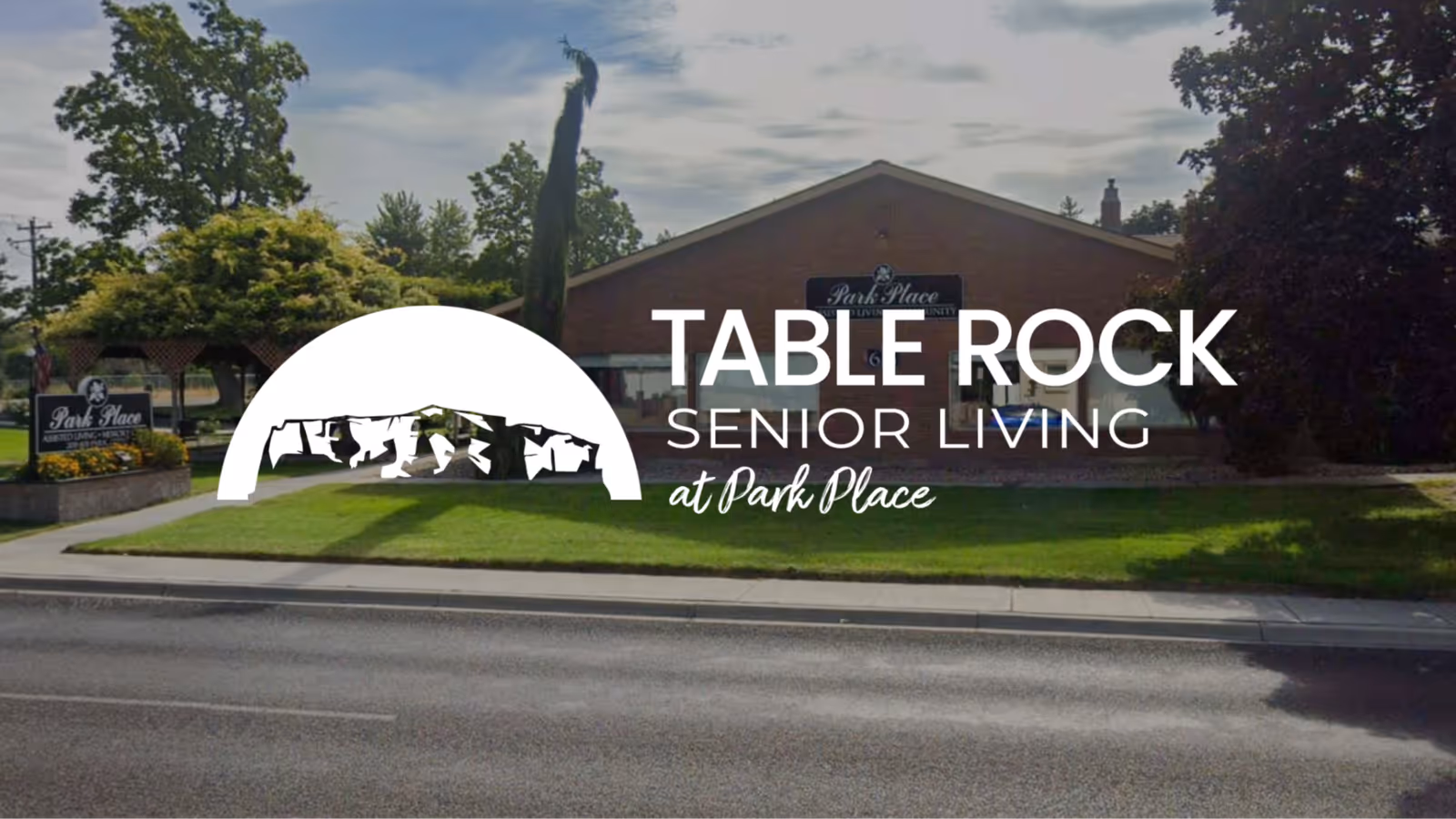 Front view of the Table Rock Senior Living at Park Place building with its logo overlaid on the lawn.