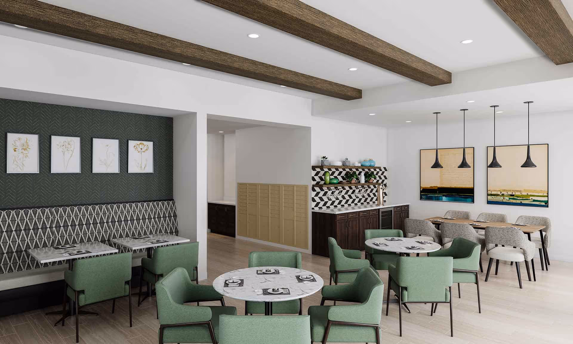 Bright communal dining room with green upholstered chairs, round and rectangular tables, wood ceiling beams, and a serving counter with decorative wall art.