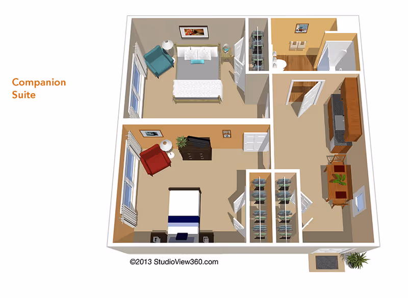 3D floor plan of a companion suite featuring two bedrooms, each with a bed, chair, and dresser. The suite includes a bathroom with a shower, a kitchen area with cabinets and appliances, and a dining table with chairs. There are closets between the bedrooms and the kitchen area.