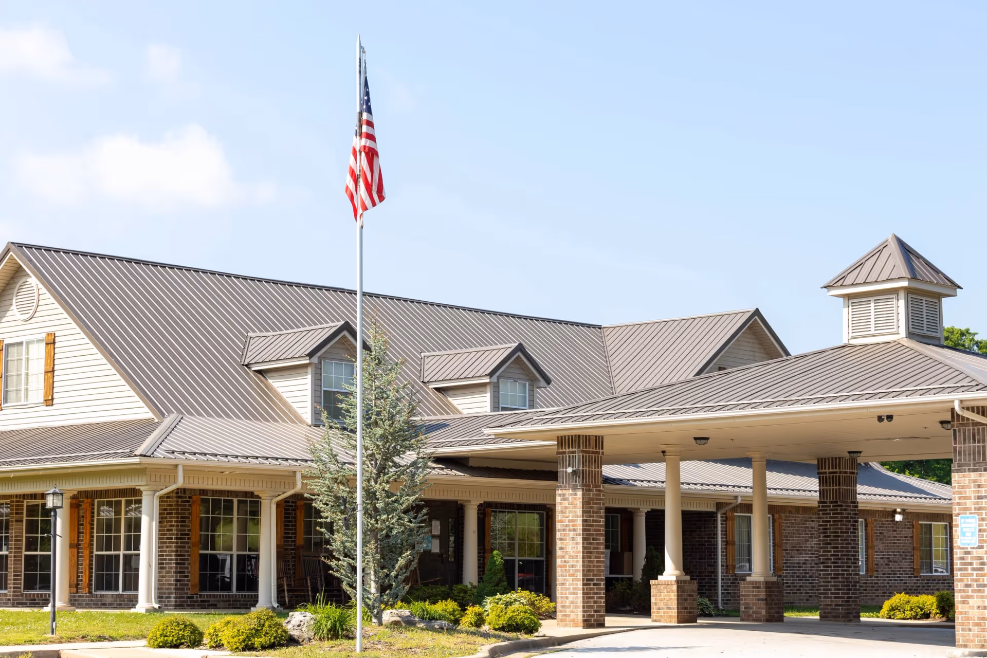 Exterior view of Countryside Health & Rehab with flagpole and covered entrance.