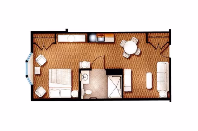 Floor plan of a studio apartment featuring a bedroom area with a bed and two chairs, a bathroom with a toilet and shower, a small kitchen area with a sink and stove, a dining area with a round table and four chairs, and a living area with a sofa, coffee table, and side table.