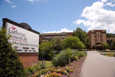 Exterior view of Lutheran SeniorLife St. John Specialty Care Center sign and buildings.