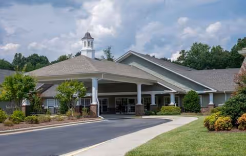 Exterior view of White Oak of Waxhaw entrance with porte-cochère and manicured landscaping.