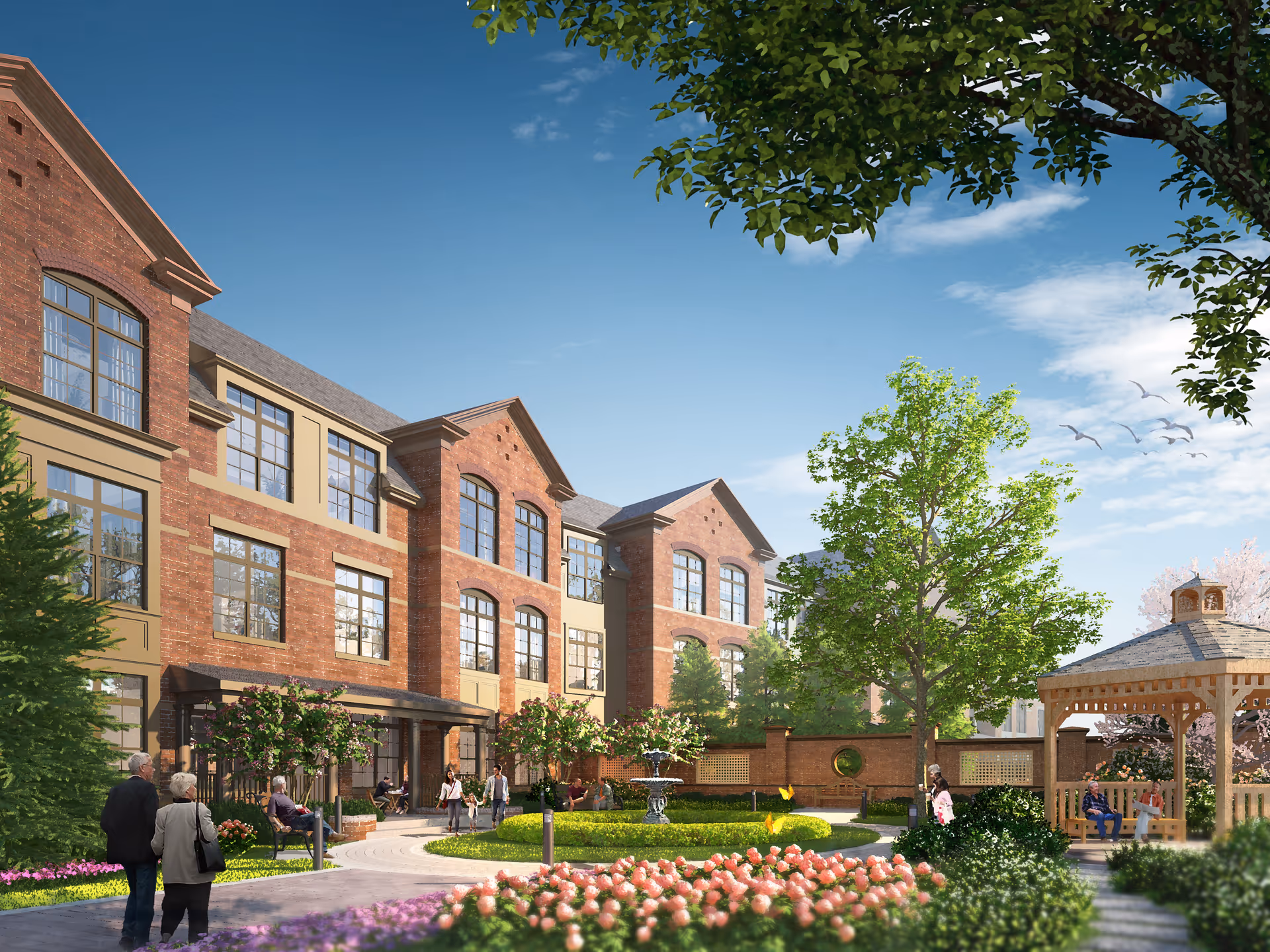 Brick three-story senior living building with a landscaped courtyard, gazebo, fountain, and people walking and sitting.