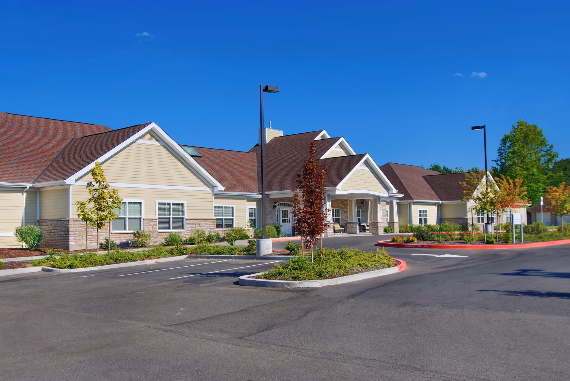 Exterior view of Brookdale Geary Street facility with entrance, parking, and landscaping.