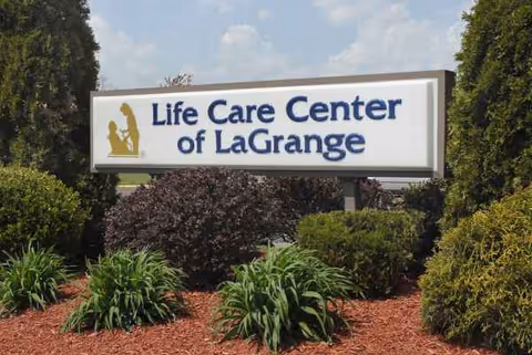 Outdoor sign for Life Care Center of LaGrange with landscaping.