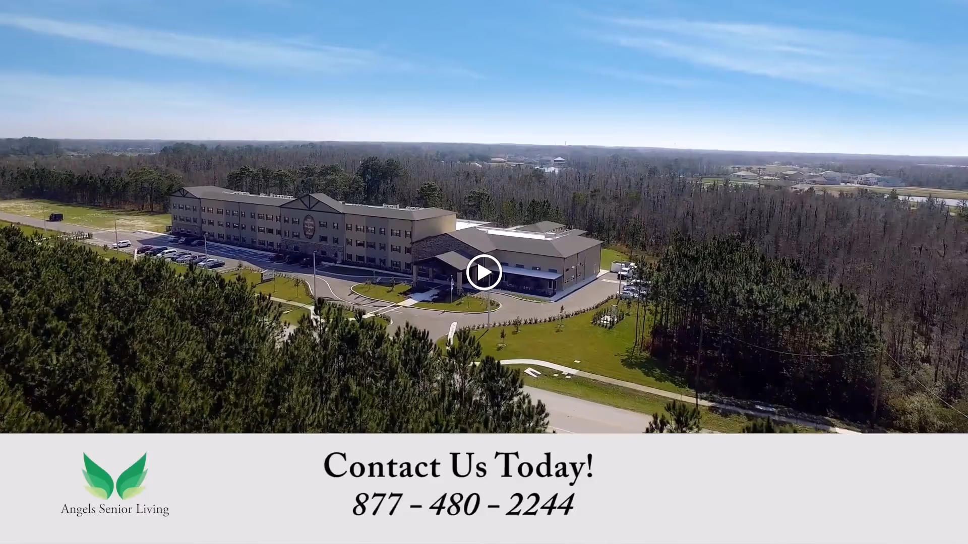 Aerial view of a multi-story senior living building surrounded by trees with a contact banner at the bottom.