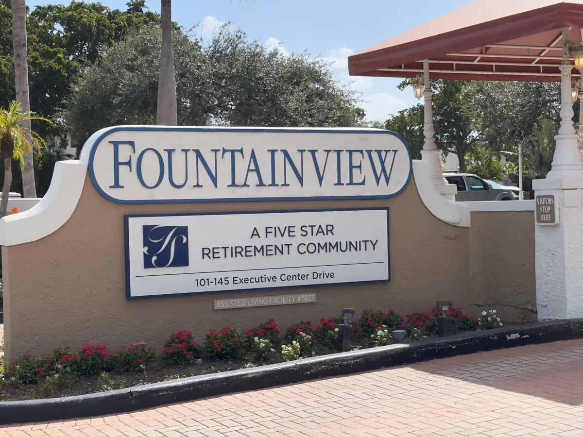 Entrance sign reading "FOUNTAINVIEW" for a five-star retirement community with address information.
