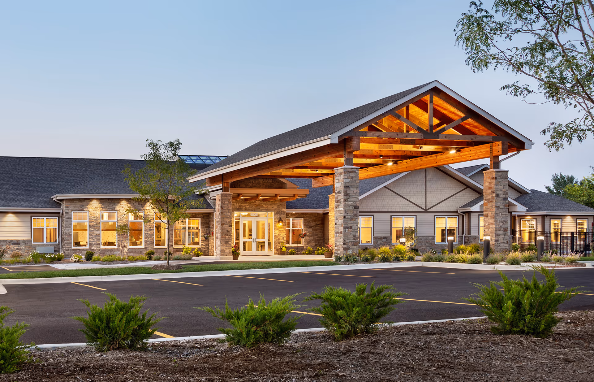 Exterior view of Silverado St. Charles Memory Care Community entrance with a covered porte-cochere.