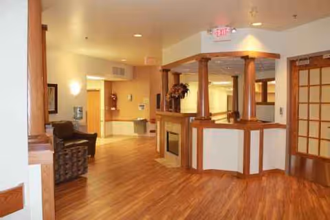 Warm lobby at Maryhill Manor - Niagara with reception desk and seating.