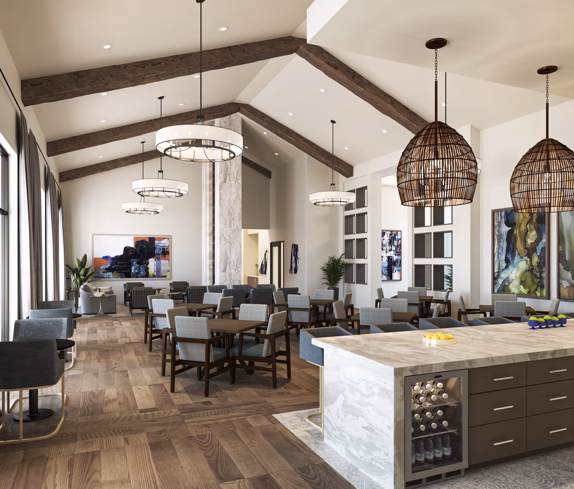 A spacious dining area with multiple wooden tables and cushioned chairs arranged neatly. The room features high vaulted ceilings with exposed wooden beams and modern pendant lights hanging down. Large windows with curtains line one side of the room, allowing natural light to fill the space. There is a marble countertop island with a built-in wine cooler and decorative bowls on top. Abstract artwork and plants decorate the walls, creating a warm and inviting atmosphere.