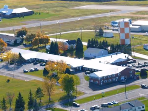 An aerial view of Caribou Rehab and Nursing Center campus with connected buildings and roads.