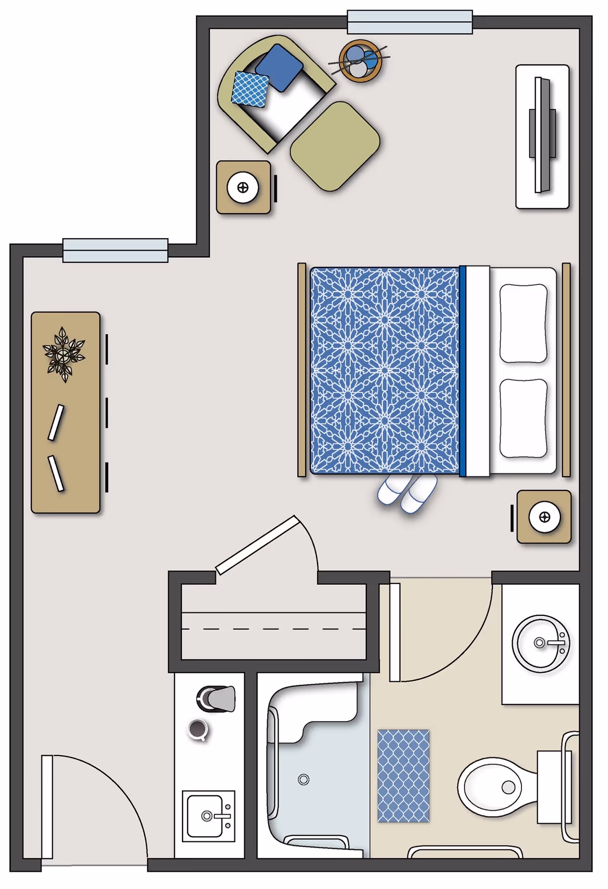 Floor plan of a senior living unit at Oakwood Senior Living showing a bedroom with a bed, nightstands, a chair with an ottoman, a TV, and a dresser. The unit also includes a bathroom with a toilet, sink, and shower, and a small kitchenette area with a sink and coffee maker.