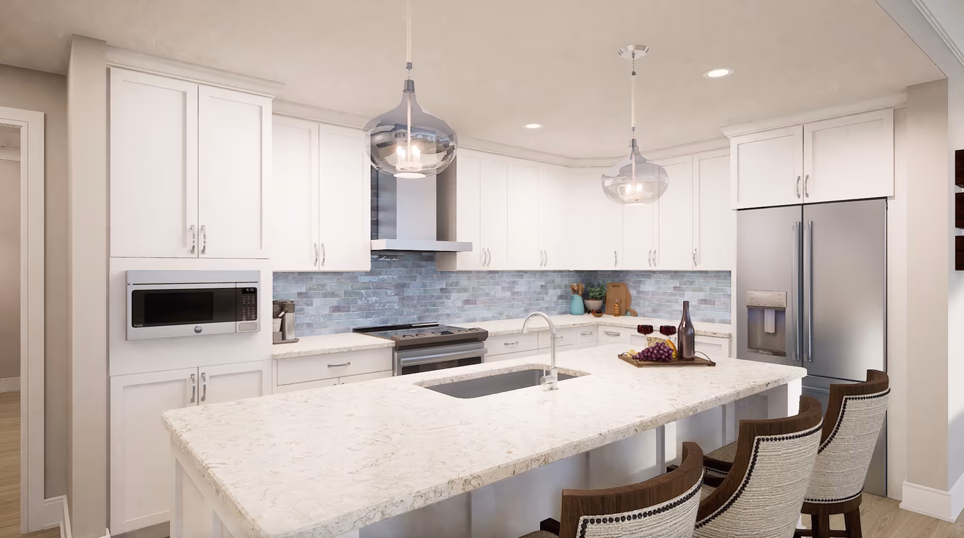 Modern kitchen with white cabinetry, a large marble island with a built-in sink, three upholstered bar stools, stainless steel refrigerator, microwave, stove, and two pendant lights hanging from the ceiling. The backsplash features light blue and gray tiles.