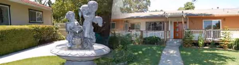 Front exterior view of Belrose Care Home with walkway, lawn, and a fountain statue