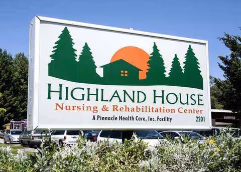 Large Highland House Nursing and Rehabilitation Center sign with trees and a sunset graphic.
