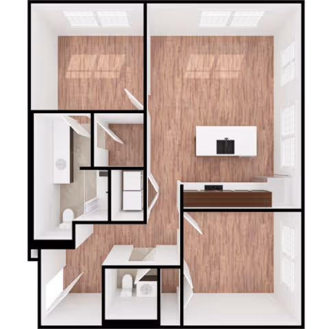 Top-down view of a floor plan showing multiple rooms with wood flooring. The layout includes a kitchen area with an island and sink, two bathrooms with toilets and sinks, and several empty rooms with windows. The walls are white, and the rooms are unfurnished except for bathroom fixtures and kitchen appliances.