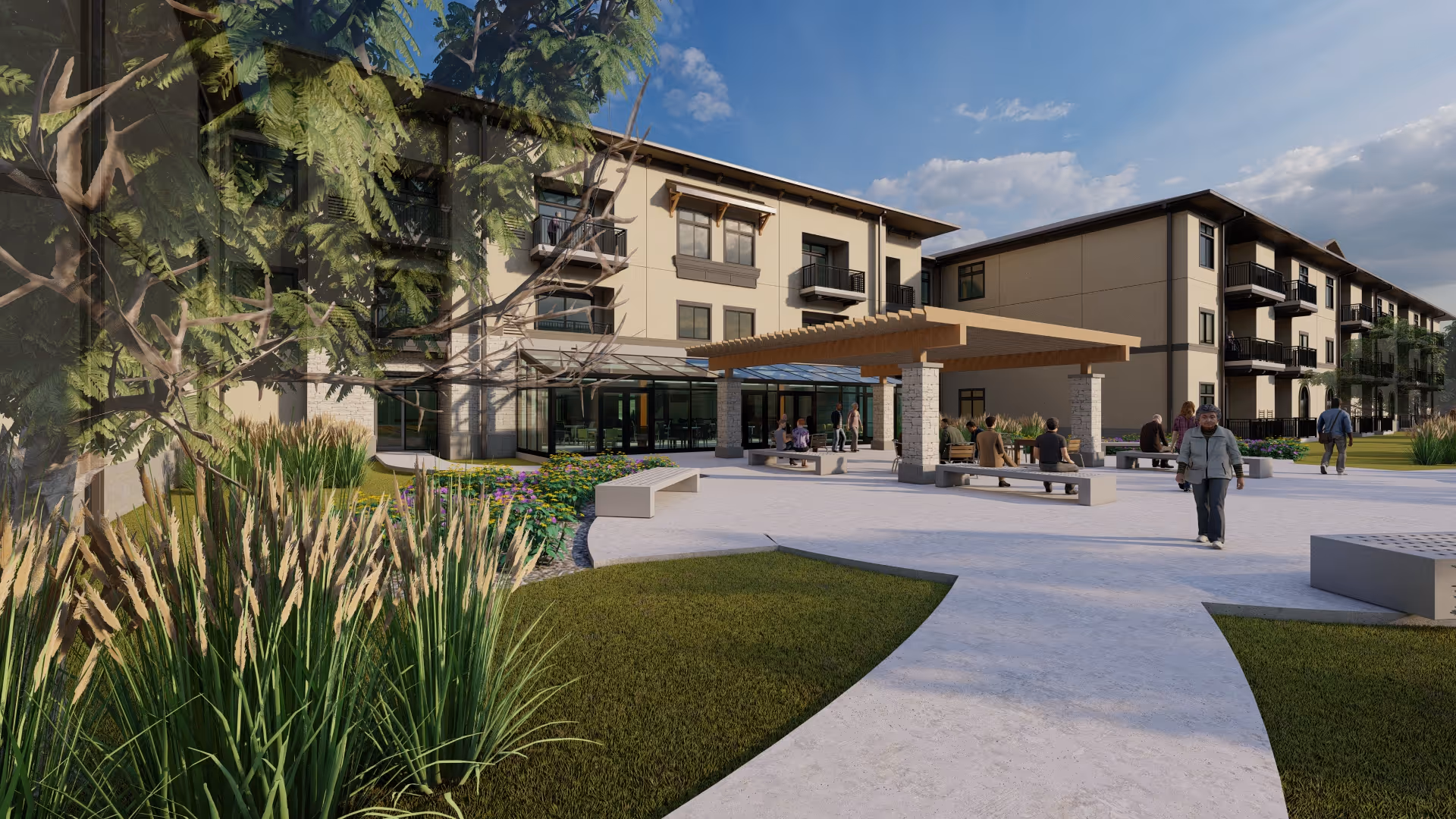 Outdoor courtyard area of The Parkwood senior living facility featuring a paved walkway, green grass, plants, and a pergola with benches. Several people are walking and sitting in the area, with the multi-story building visible in the background under a partly cloudy sky.