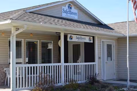 Front view of a Safe Haven Healthcare facility with a porch and sign.