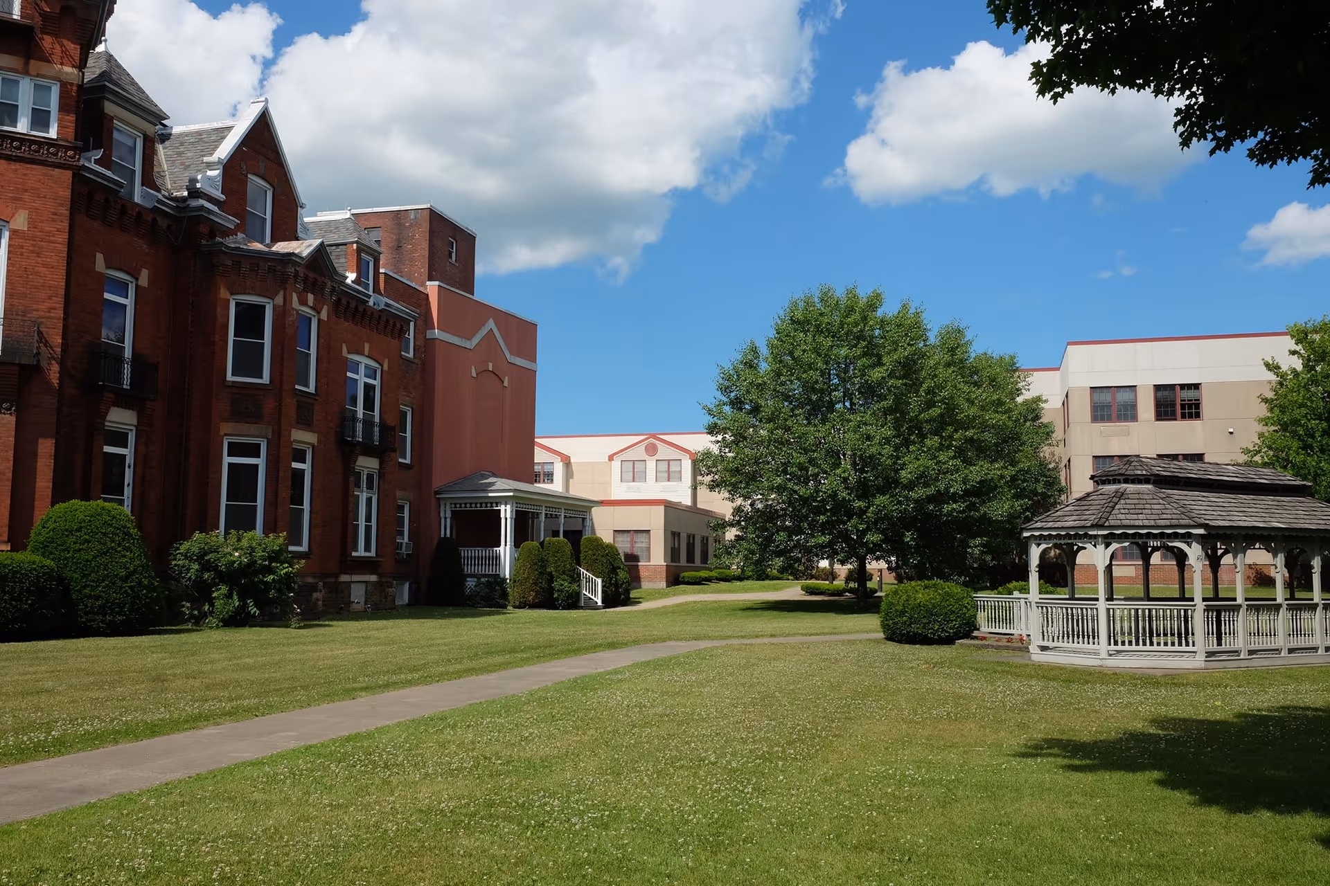 View of Foltsbrook Center Nursing and Rehabilitation featuring a gazebo and landscaped grounds.