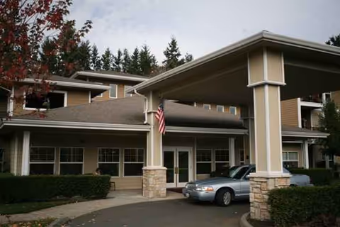 Exterior view of Olympic Place by Bonaventure senior living facility with porte-cochère.