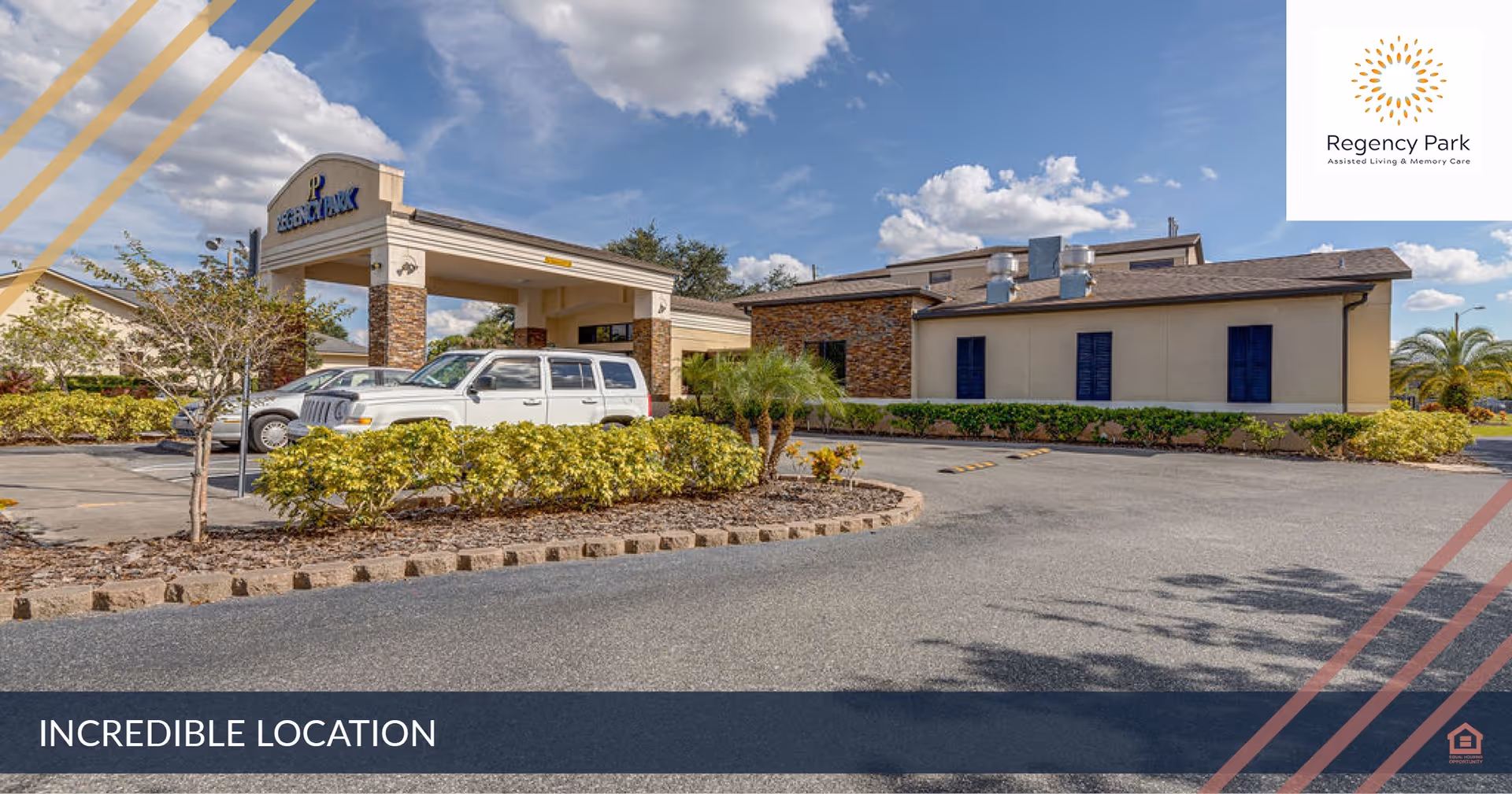 Exterior view of Regency Park Assisted Living & Memory Care building with a covered entrance, parked cars, landscaping, and a clear blue sky with some clouds.