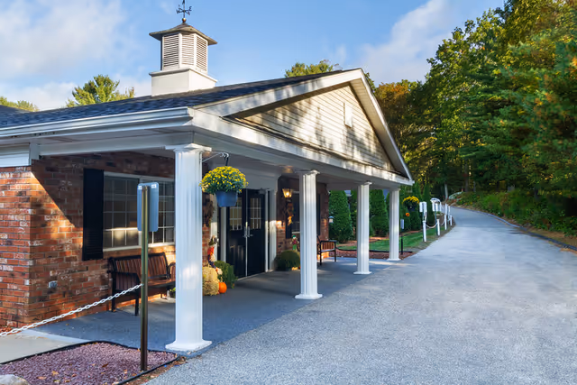 Exterior view of Marlborough Health and Rehabilitation Center entrance with a curved driveway.