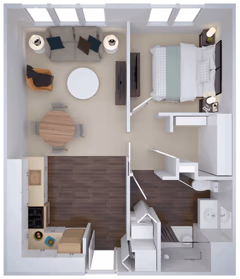 Top-down view of a one-bedroom apartment floor plan featuring a living room with a sofa, armchair, round coffee table, and round dining table with four chairs. The bedroom has a bed, two nightstands with lamps, and a TV mounted on a stand. The kitchen includes a stove, sink, and countertop. There is a bathroom with a shower, toilet, and double sink vanity. The flooring is a mix of carpet and wood.
