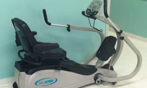 NuStep exercise bike in a rehab facility interior.