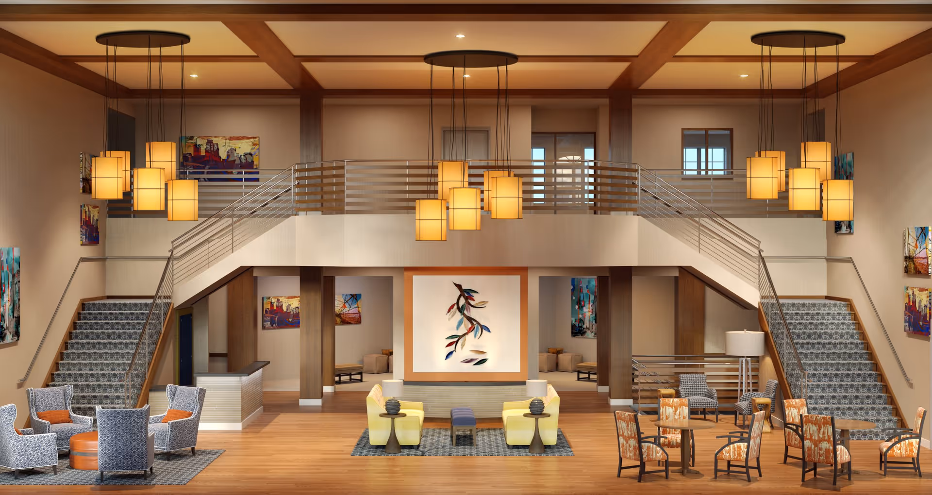 Spacious two-story lobby with seating areas, twin staircases, and multiple hanging pendant lights.